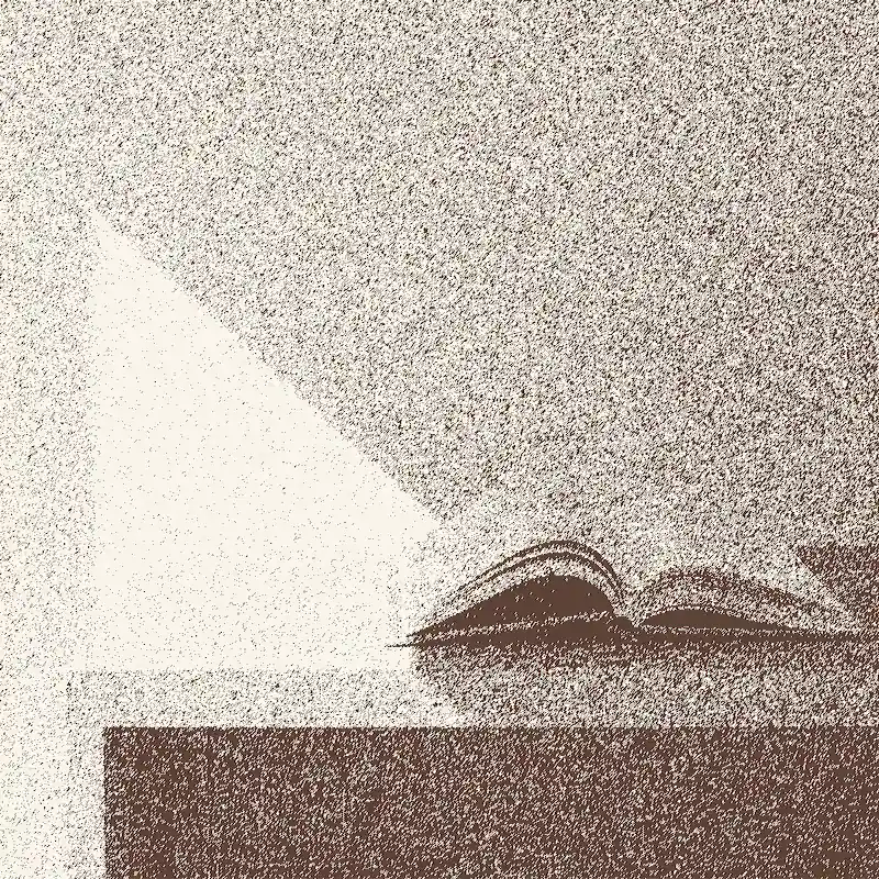 An open book on a desk by the window in a bright morning.